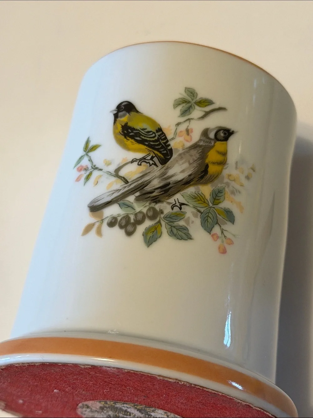 Vintage ceramic candleholder with yellow finch on both sides.  Good condition.